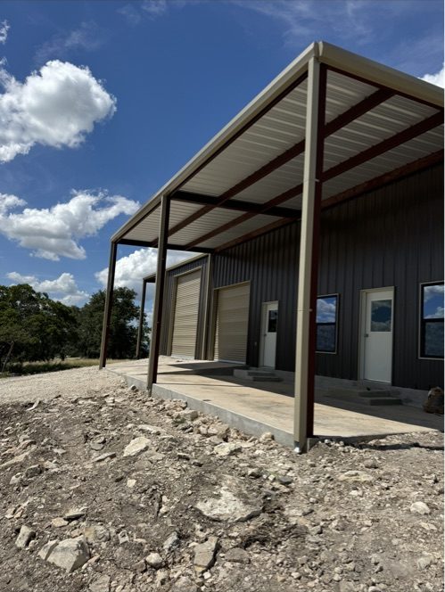 Metal building with covered porch and entry doors, Canyon Lake TX