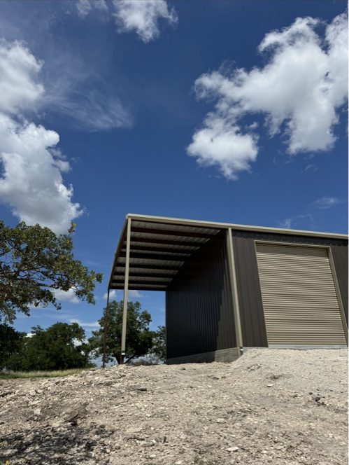 Metal building with covered overhang, Central Texas