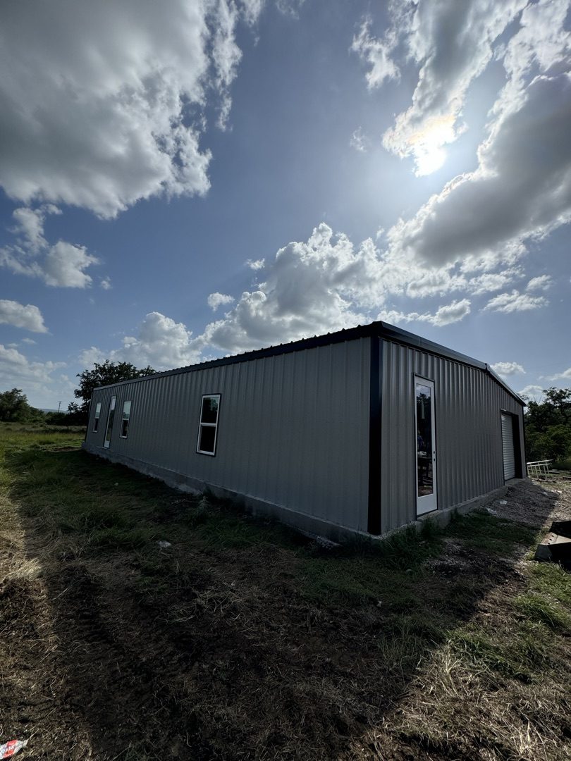 Completed steel building with sun flare, Central Texas