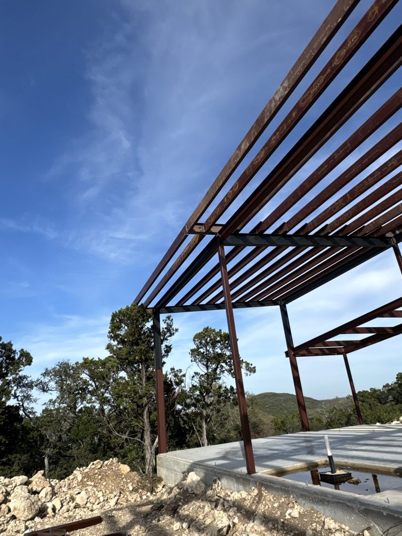 Structural steel frame against blue sky, Texas Hill Country
