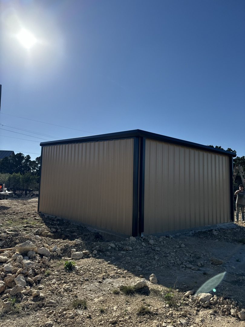 Tan and black metal building with trim accents, Canyon Lake TX